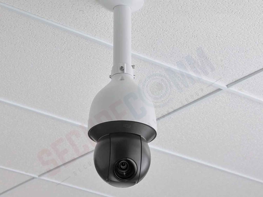 PTZ camera mounted on a white ceiling with a pole mount, illustrating a common indoor installation method for versatile surveillance.