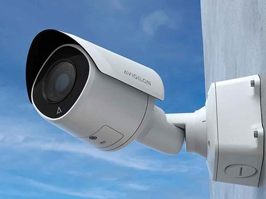 Modern smart security camera with high-definition lens, illustrating advanced features for home and business surveillance.